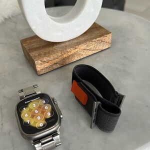 Apple Silver Smartwatch with Black and Orange Strap